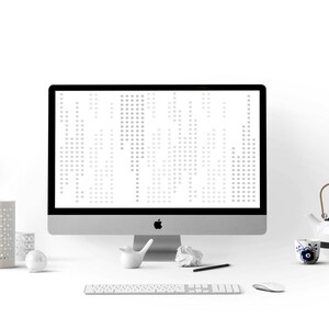 May include: A white desktop computer with a blank screen, a white keyboard, a white mouse, a white lamp, a white ceramic pencil holder, a white ceramic teapot, a white ceramic cup, a panda figurine, a white ceramic bird figurine, a crumpled piece of paper, and a black pen on a white desk.