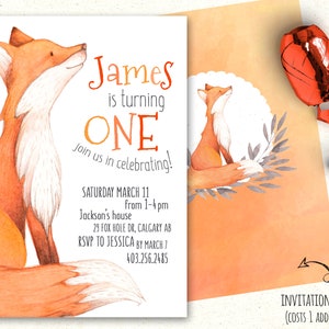 May include: A white invitation card with a fox illustration. The text reads "James is turning ONE. Join us in celebrating!"  The invitation details include the date, time, location, RSVP information, and phone number.