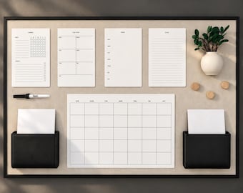 May include: A large rectangular wall-mounted magnetic board with a black frame, featuring a white monthly calendar, four smaller white planners labeled Chores, This Week, Menu, and To Do, two black storage pockets, a black marker, and a small vase.