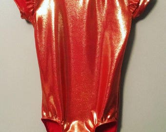 Short sleeve Leotard with ruffles in shiny orange. Only size 8-9yr left. Ready to be shipped out.