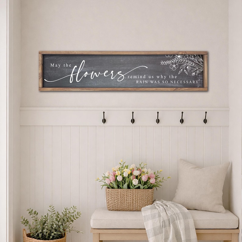 May include: A distressed wooden sign with the words "Welcome to our home" in white lettering. The sign has a rustic finish, ideal for adding a welcoming touch to any home's entrance.