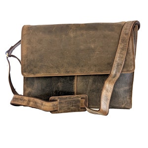 May include: A brown leather messenger bag with a long adjustable strap. The bag has a flap closure and a front pocket.