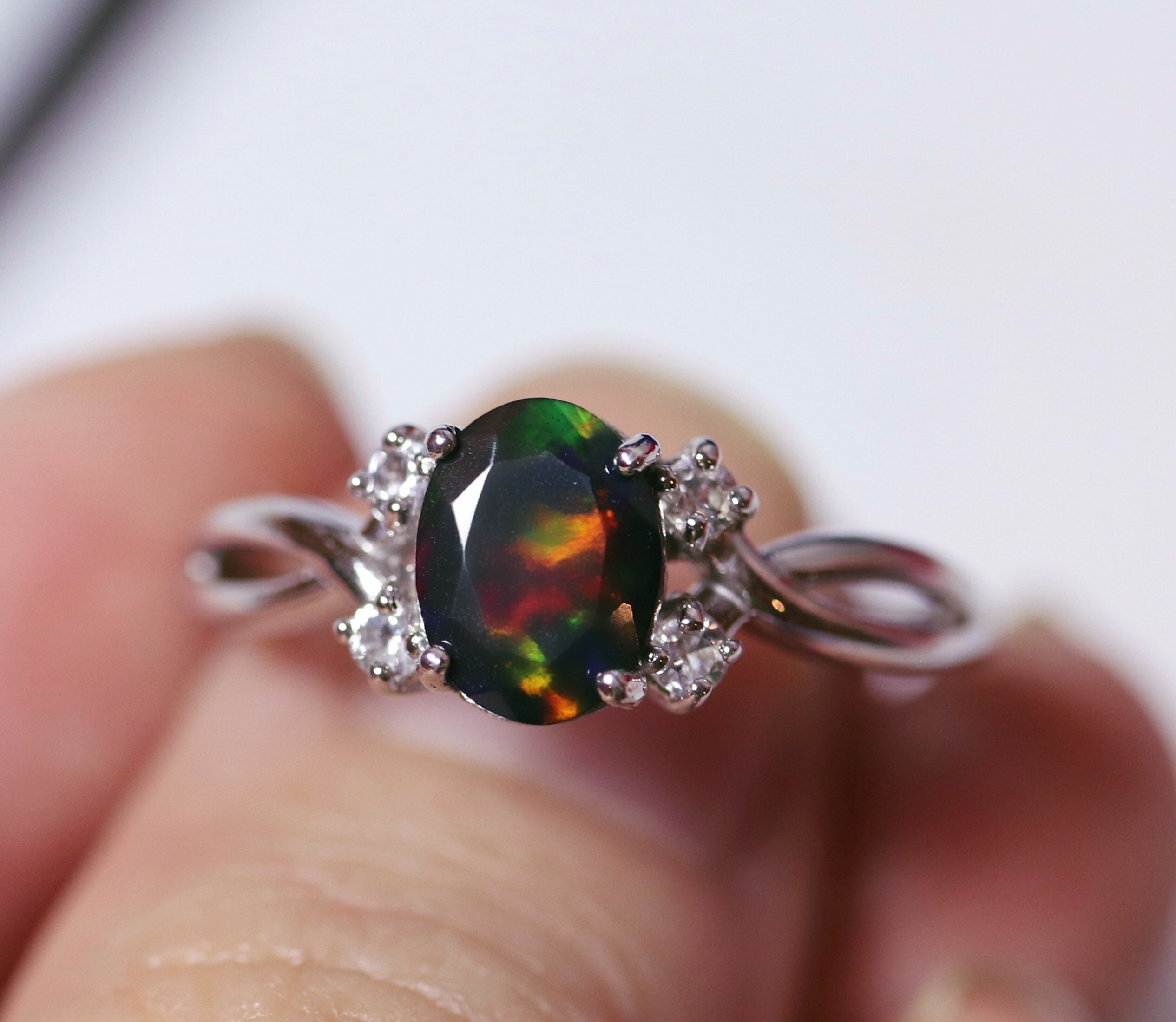 Natural black fire opal engagement ring made w white topaz accent stones on both sides and a
