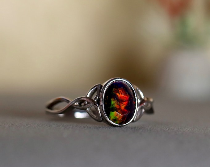 Black Opal Silver Ring Handcrafted in Celtic style with a genuine black opal gemstone and delicate 14k white gold filled Celtic knot band