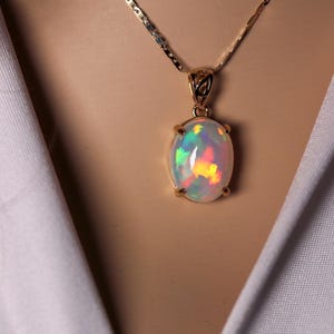 Natural Large Ethiopian Opal Necklace handmade with a genuine fire opal oval pendant in 14k solid gold with a delicate gold chain necklace