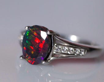 Black fire opal engagement ring handcrafted with a genuine black opal gemstone set in a white gold filled ring paved with white topaz accent