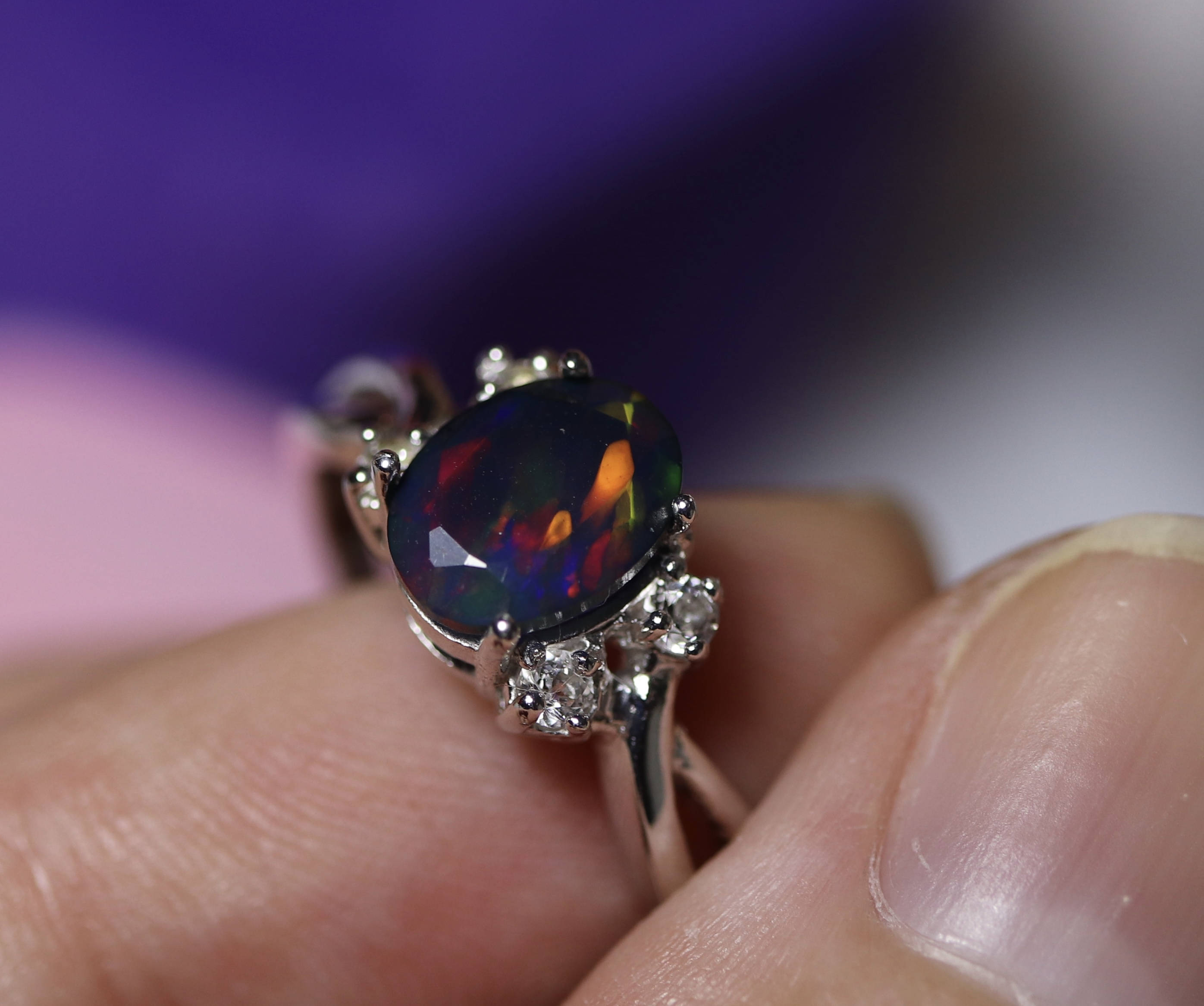 Natural black fire opal engagement ring made w white topaz accent stones on both sides and a