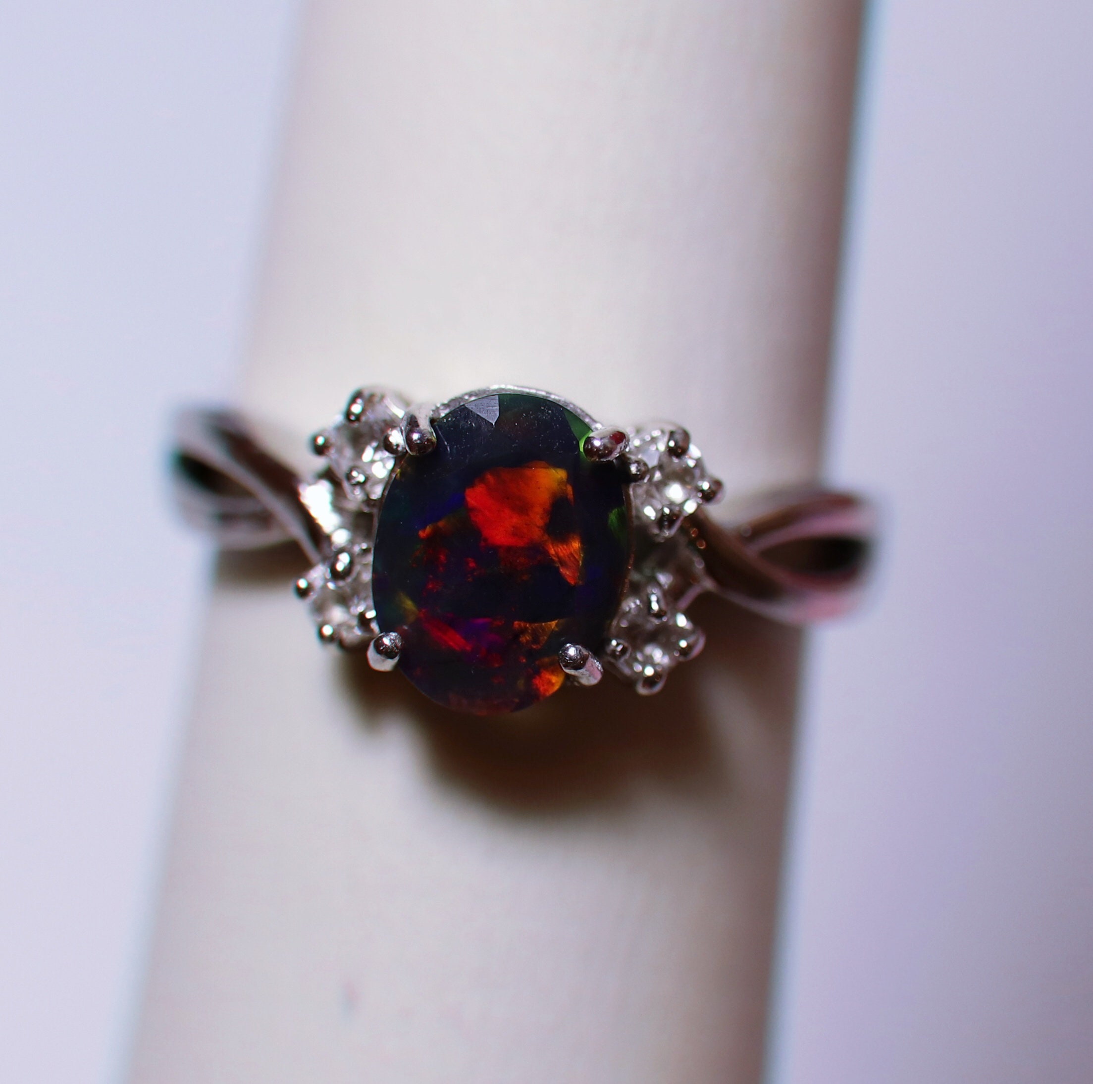 Natural black fire opal engagement ring made w white topaz accent stones on both sides and a