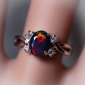 Natural black fire opal engagement ring made w white topaz accent stones on both sides and a fabulous rare 8x6mm black opal