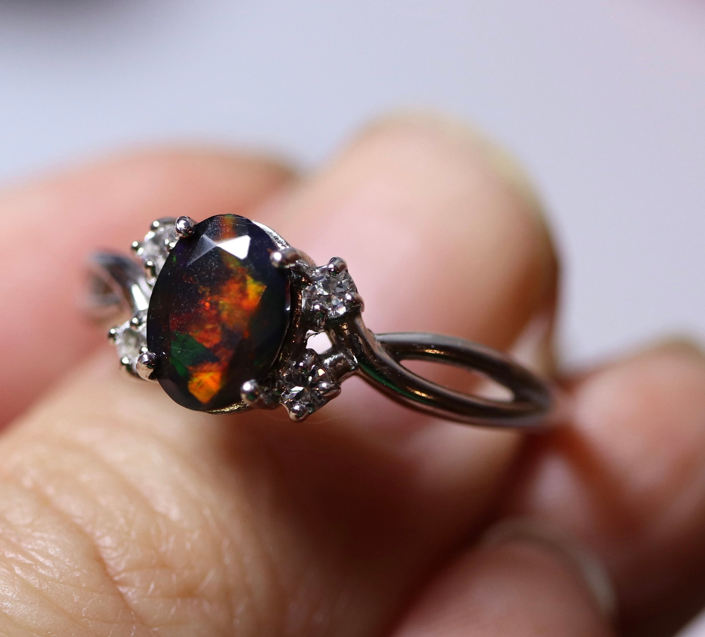 Natural black fire opal engagement ring made w white topaz accent stones on both sides and a