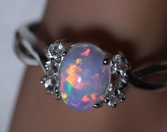 Wonderful glimmering fire opal, unique color palette, dainty opal ring, accented opal ring, opal engagement ring, delicate silver opal ring
