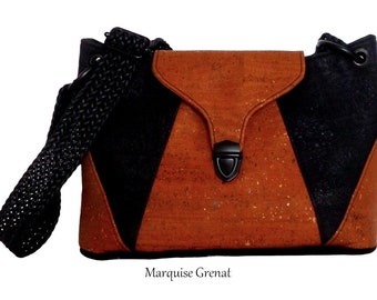 Luxury black and caramel cork flap zipped crossbody bag in modern vegan baguette style