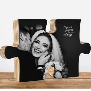 May include: A black and white photograph of a couple kissing, printed on a wooden jigsaw piece. The jigsaw piece is shaped like a heart and has the text "You will forever be my always" on the right side.