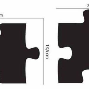 May include: Two black puzzle pieces, each measuring 20 inches by 13.5 inches. The pieces are shown side-by-side.