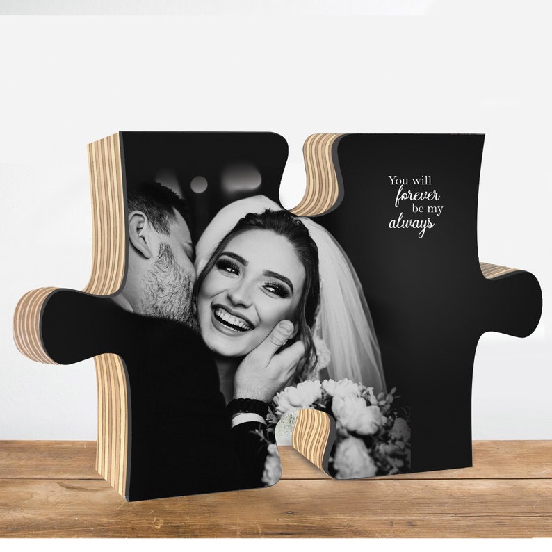 May include: A black and white photograph of a couple kissing, printed on a wooden jigsaw piece. The jigsaw piece is shaped like a heart and has the text "You will forever be my always" on the right side.