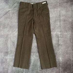 May include: Brown trousers with a classic, straight-leg design. The pants feature a button and zipper closure, belt loops, and front pockets. The fabric has a subtle texture, and the trousers are suitable for various occasions.