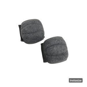 May include: A pair of charcoal gray knee pads featuring a textured, felt-like fabric surface with horizontal stitched channels for flexibility. The pads have a rounded, rectangular shape with dark trim along the sides and the text instasize.