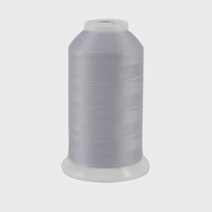May include: A spool of light gray thread, tightly wound around a white plastic base. The thread has a subtle sheen, and the spool is cylindrical with a slightly tapered top. Ideal for sewing and embroidery projects.