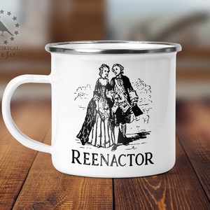 May include: White enamel mug with a black and white illustration of a couple in period clothing. The text "REENACTOR" is printed below the illustration.