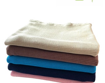 Baby blanket knitted from cotton in several colors