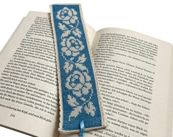 Embroidered bookmark with roses on a blue background