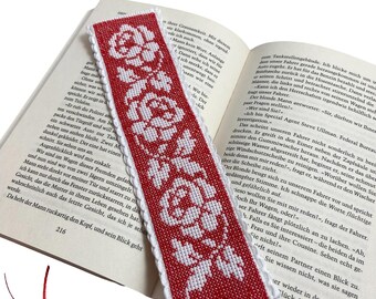 Embroidered bookmark with roses on red background