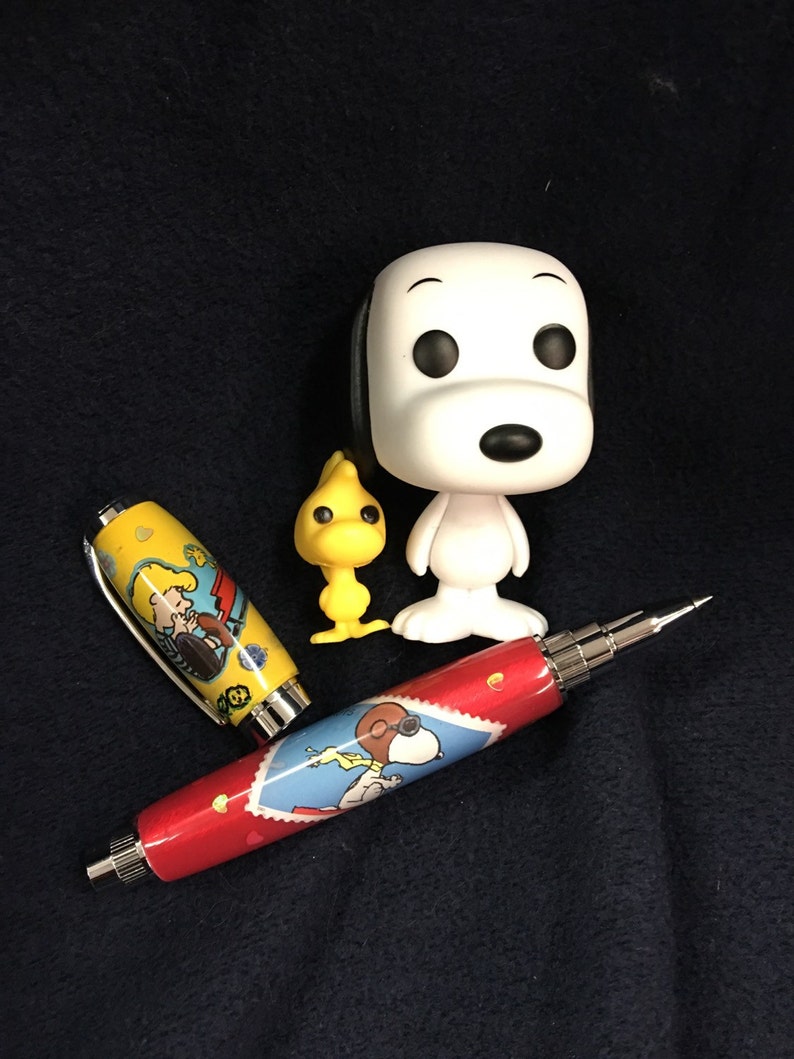 Snoopy and Woodstock pen with matching Funko Figures | Etsy