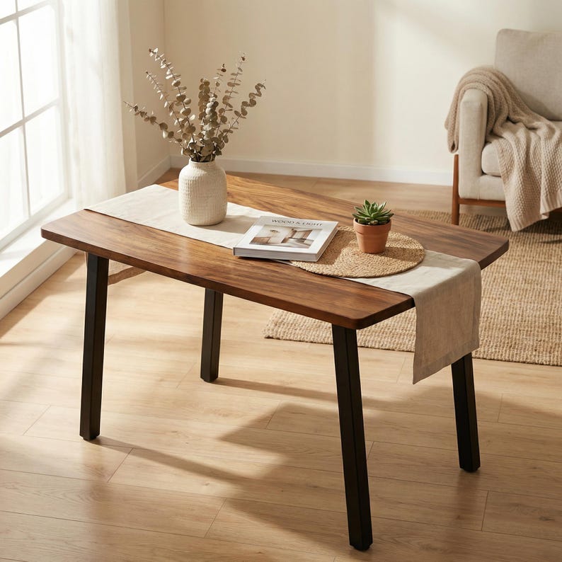 Walnut dining table with solid wood rectangular top, rich natural wood grain, black metal legs, and modern dining room decor in a bright home interior.
