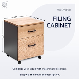 May include: A two-drawer filing cabinet with a light wood grain finish on the drawers and top, and a dark gray body. The cabinet is 16 inches wide, 15 inches deep, and 21 inches tall. It has black handles and sits on black wheels. The text "FILING CABINET" is displayed.
