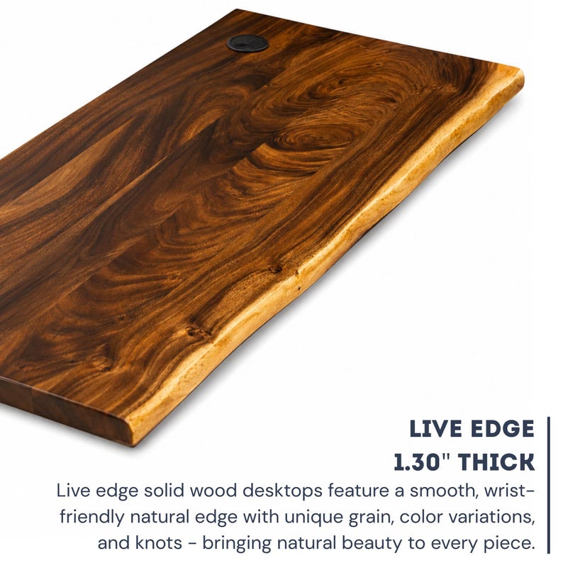 Close-up of a handcrafted solid walnut live edge desk top showing rich natural wood grain, smooth wrist-friendly edge, 1.30 inch thickness, knots, color variations, and cable grommet hole.