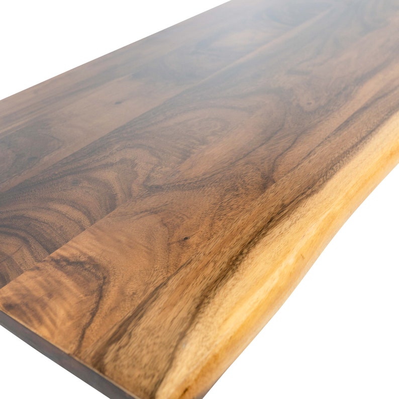 Real wood desk table top crafted from solid walnut, featuring a distinctive natural live edge, perfect for a unique and stylish workspace.