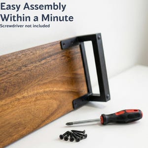 May include: Walnut monitor stand with black metal legs, shown with screws and screwdriver for quick and easy assembly.