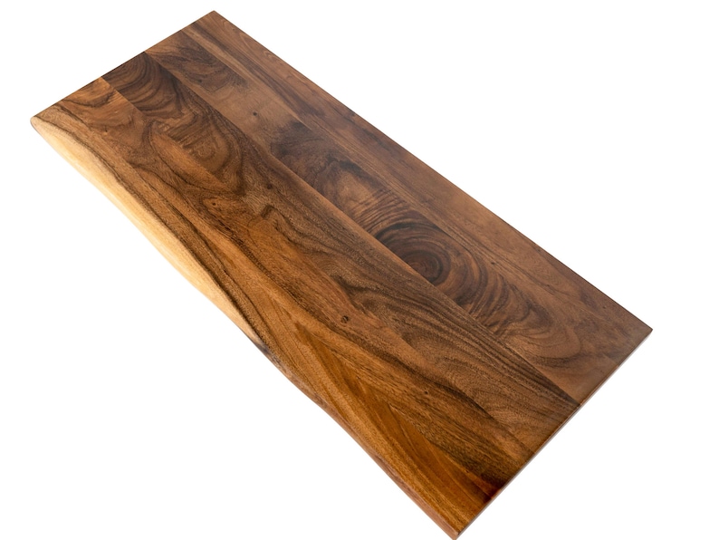 Solid walnut wood desk top featuring a natural live edge and an eco-friendly finish, ideal for crafting custom wood table tops.