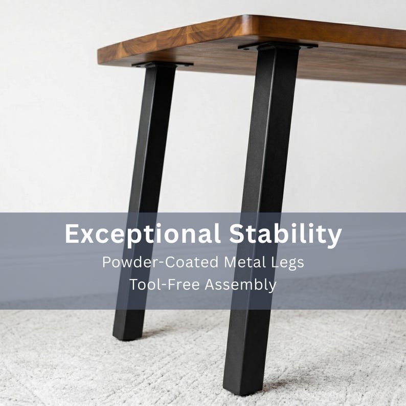 May include: A rectangular walnut dining table with a rich brown finish. It features black, powder-coated metal legs with adjustable feet for stability. The image includes the text "Exceptional Stability".