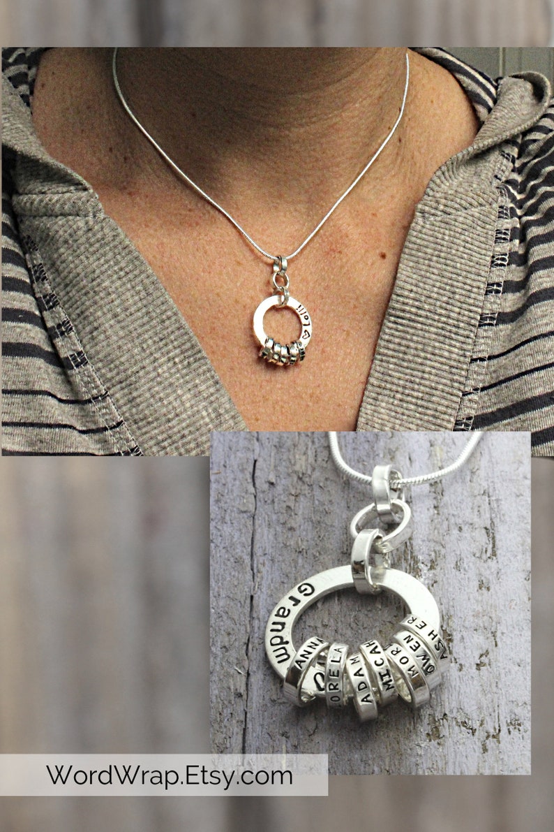 Sterling silver necklace for Grandmother with tiny rings stamped with grandkids names, around a washer around a woman's neck.