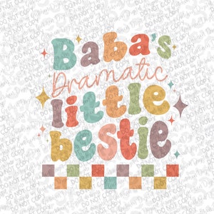 May include: A colorful graphic design with the text "Baba's Dramatic Little Bestie" in a retro style. The text is in various shades of pink, orange, yellow, green, and blue. A checkered pattern in shades of orange, yellow, and brown is below the text.