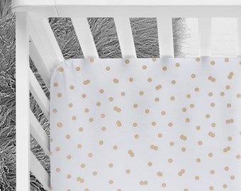You can choose from different patterns, colors, materials and sizes. gold crib sheet etsy