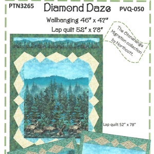 May include: A Diamond Daze quilt pattern by PineRose Designs. The design features a forest scene with deer, mountains, and trees. The wallhanging measures 46 x 47 inches, and the lap quilt is 52 x 78 inches. The Stonehenge Migration collection by Northcott.
