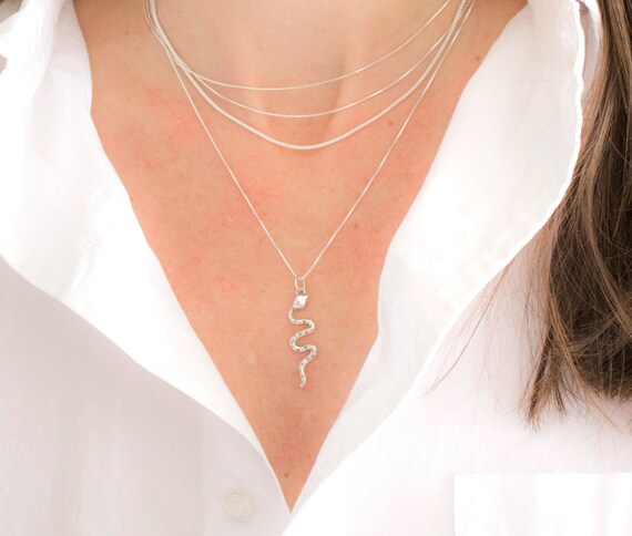 Twisted store snake pendant