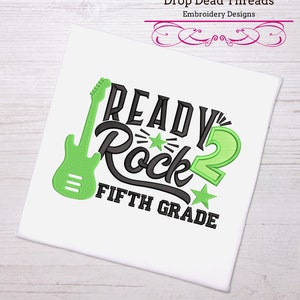 May include: Embroidered design featuring a green electric guitar, the words "Ready to Rock", a green number 2, and the text "Fifth Grade".