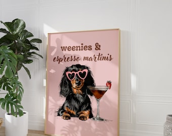 May include: A black and brown dachshund wearing pink heart-shaped sunglasses and holding a martini glass with a strawberry garnish. The text "weenies & espresso martinis" is written in brown letters on a pink background.