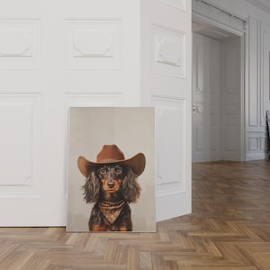 May include: A brown and black dachshund wearing a brown cowboy hat and a brown bandana. The dog is looking directly at the camera.