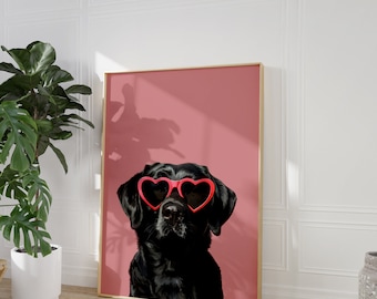 May include: A black Labrador Retriever wearing heart-shaped sunglasses on a pink background.