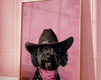 May include: A black dog wearing a brown cowboy hat and a pink bandana against a pink background.