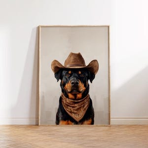 May include: A black and tan Rottweiler dog wearing a brown cowboy hat and a brown bandana. The dog is looking directly at the camera.