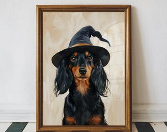 May include: Framed artwork featuring a long-haired dachshund wearing a black witch hat with a gold buckle. The dog has black and tan fur and brown eyes. The artwork is in a wooden frame and set against a neutral background.