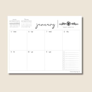 May include: A white weekly planner with the month of January displayed. The planner includes a calendar for January and February, with the days of the week and dates. The word "January" is written in cursive, and the year "Twenty Twenty Six" is written in a decorative font.