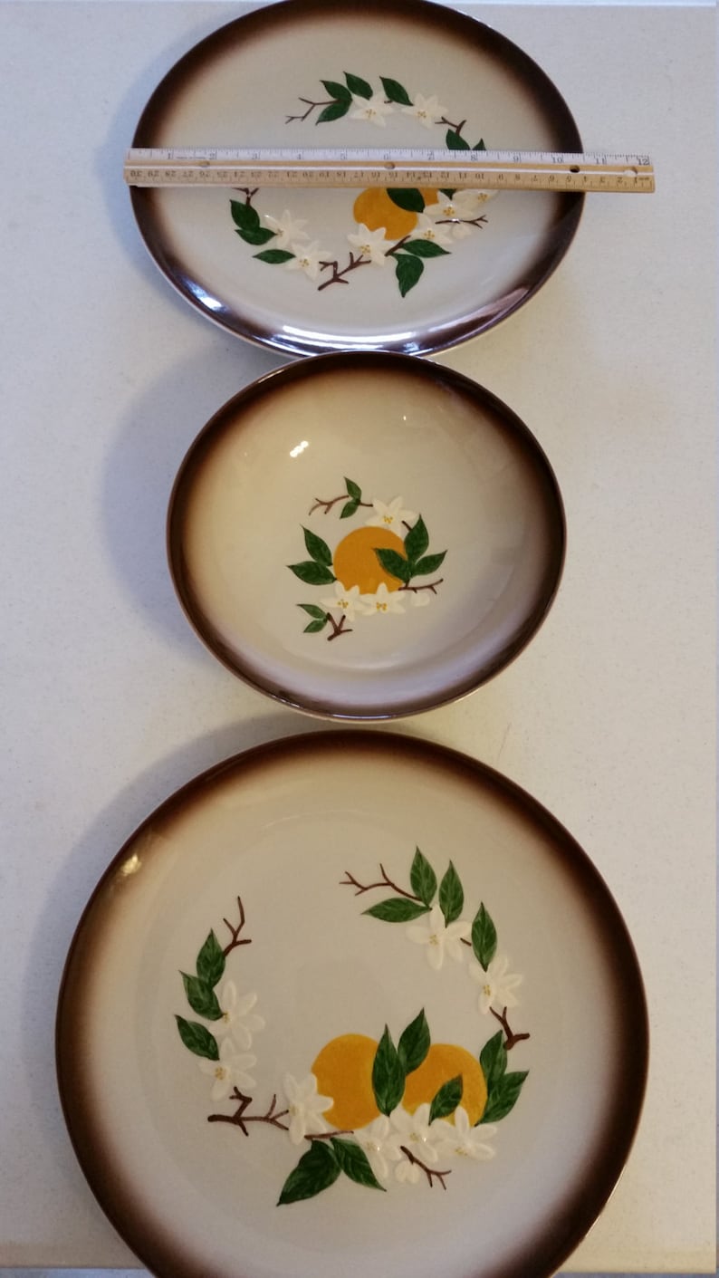 vintage orchard ware plates and bowl california retro 1950 era dinnerware oranges and blossoms ceramic hand decorated fruit decor kitchen
