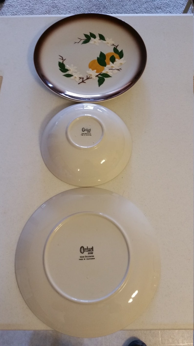 vintage orchard ware plates and bowl california retro 1950 era dinnerware oranges and blossoms ceramic hand decorated fruit decor kitchen