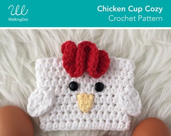 May include: White crocheted chicken cup cozy with red crocheted comb and yellow beak. The cozy is on a white fluffy surface with two brown eggs. The text "Chicken Cup Cozy Crochet Pattern" and "Digital PDF Pattern Download" is on the image.